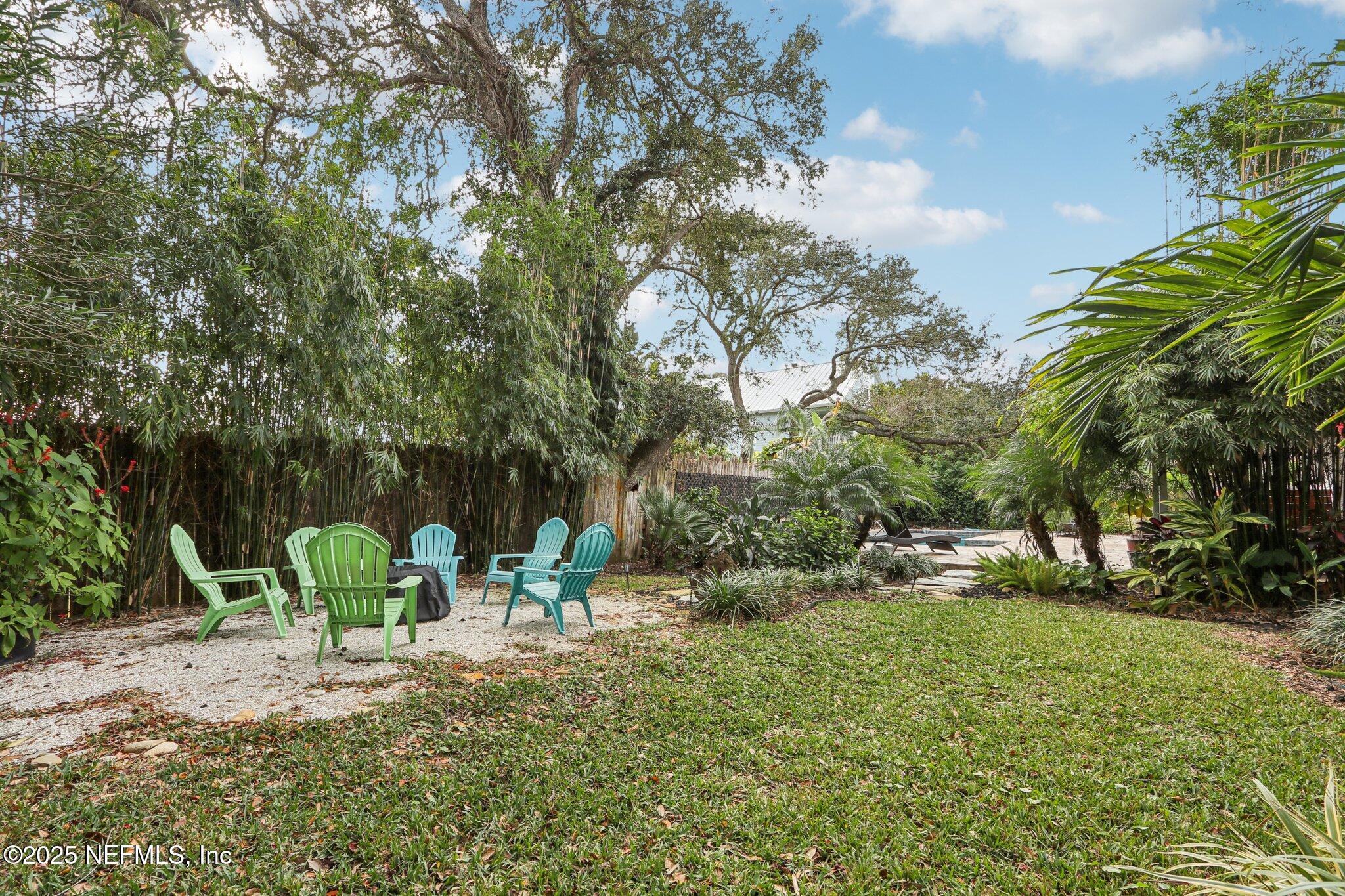 409 Seventeenth Street St. Augustine, FL 32084 - Photo 42 of 42 a view of a table and chairs in the garden
