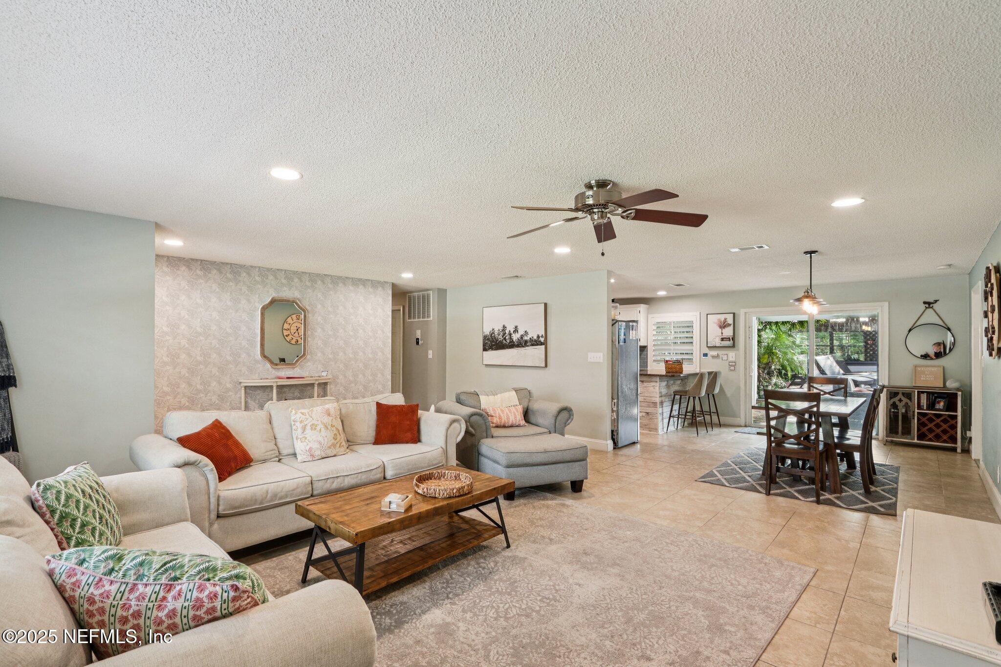409 Seventeenth Street St. Augustine, FL 32084 - Photo 10 of 42 a living room with furniture and a large window