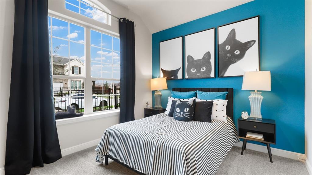 243 Windmill Drive Rhome, TX 76078 - Photo 24 of 39 a bedroom with a bed and a painting on the wall