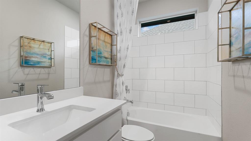 243 Windmill Drive Rhome, TX 76078 - Photo 26 of 39 a bathroom with a sink toilet and shower