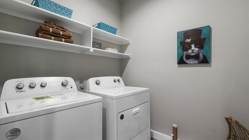 243 Windmill Drive Rhome, TX 76078 - Photo 4 of 39 a utility room with dryer and washer