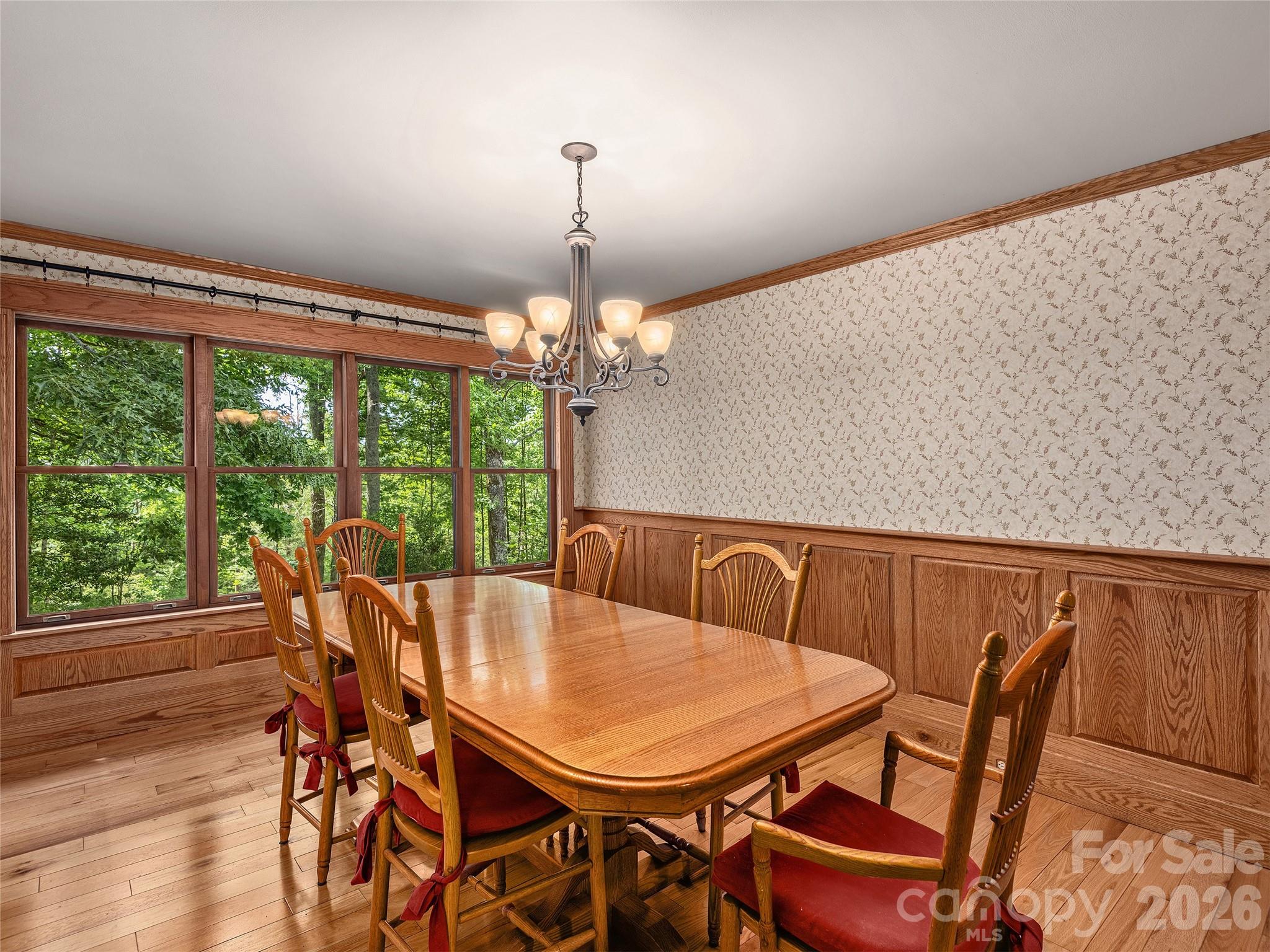 40 Deer Ridge Road Mills River, NC 28759 - Photo 5 of 35 a view of a dining room with furniture wooden floor and chandelier