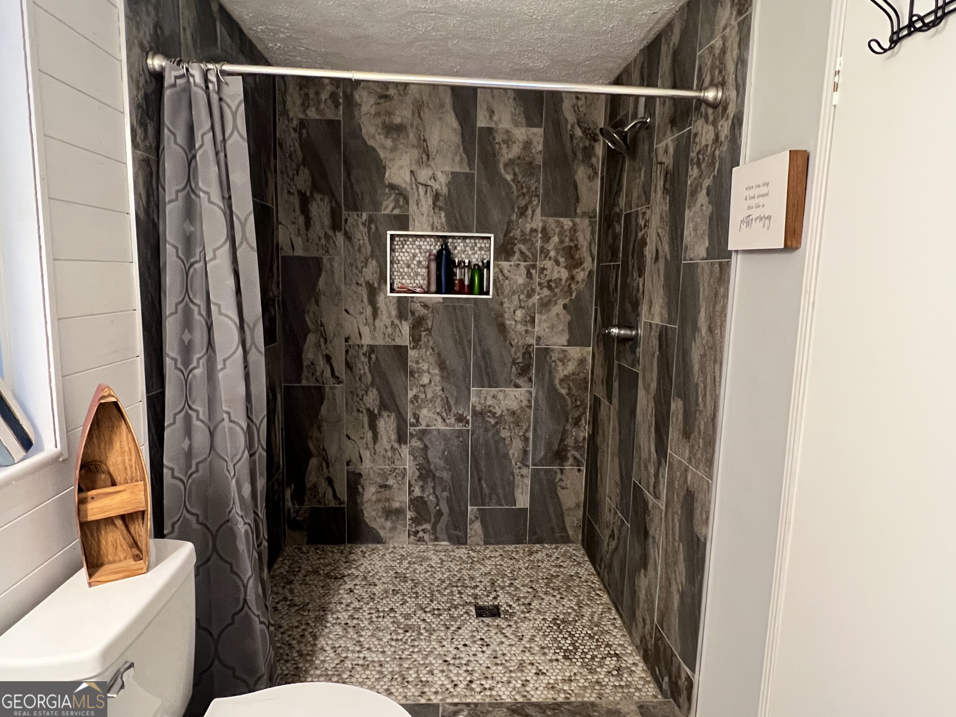 64 Bay Point Sparta, GA 31087 - Photo 12 of 53 a bathroom with a toilet and a shower