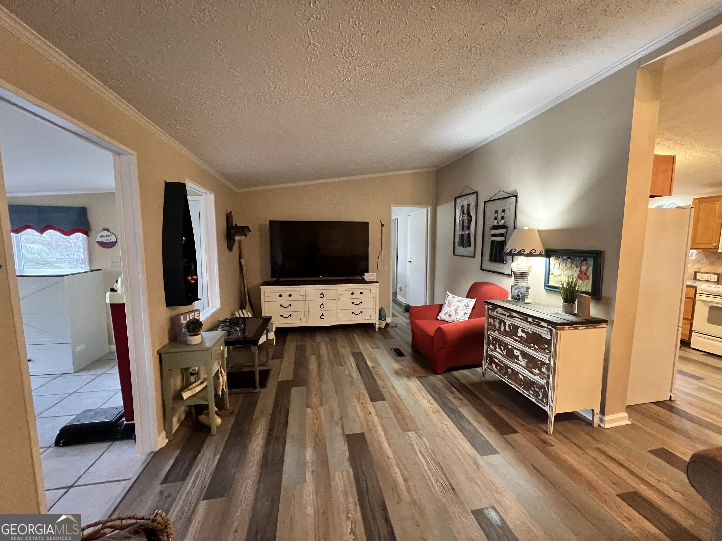 64 Bay Point Sparta, GA 31087 - Photo 14 of 53 a living room with furniture and a flat screen tv