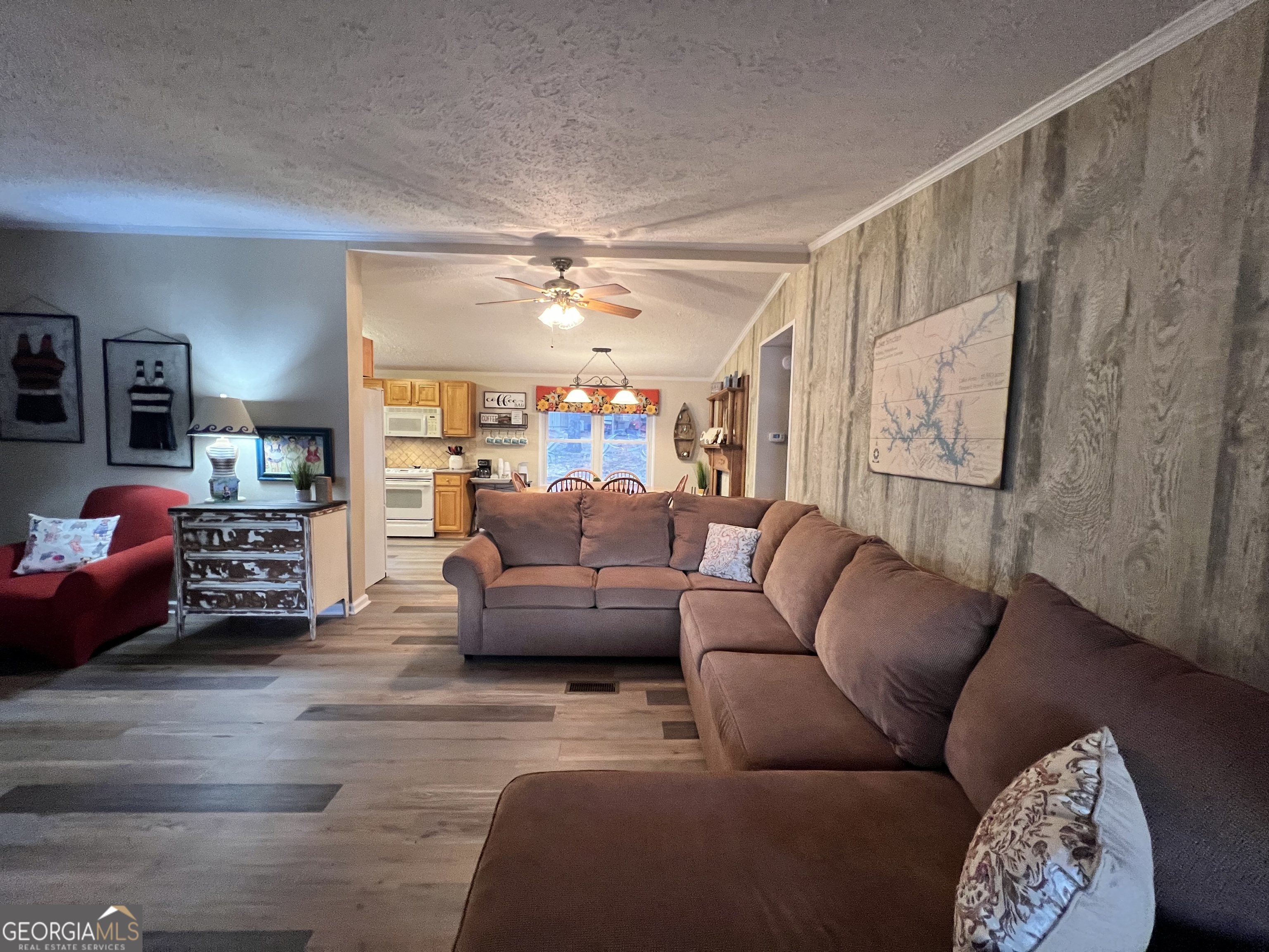64 Bay Point Sparta, GA 31087 - Photo 20 of 53 a living room with furniture and a chandelier