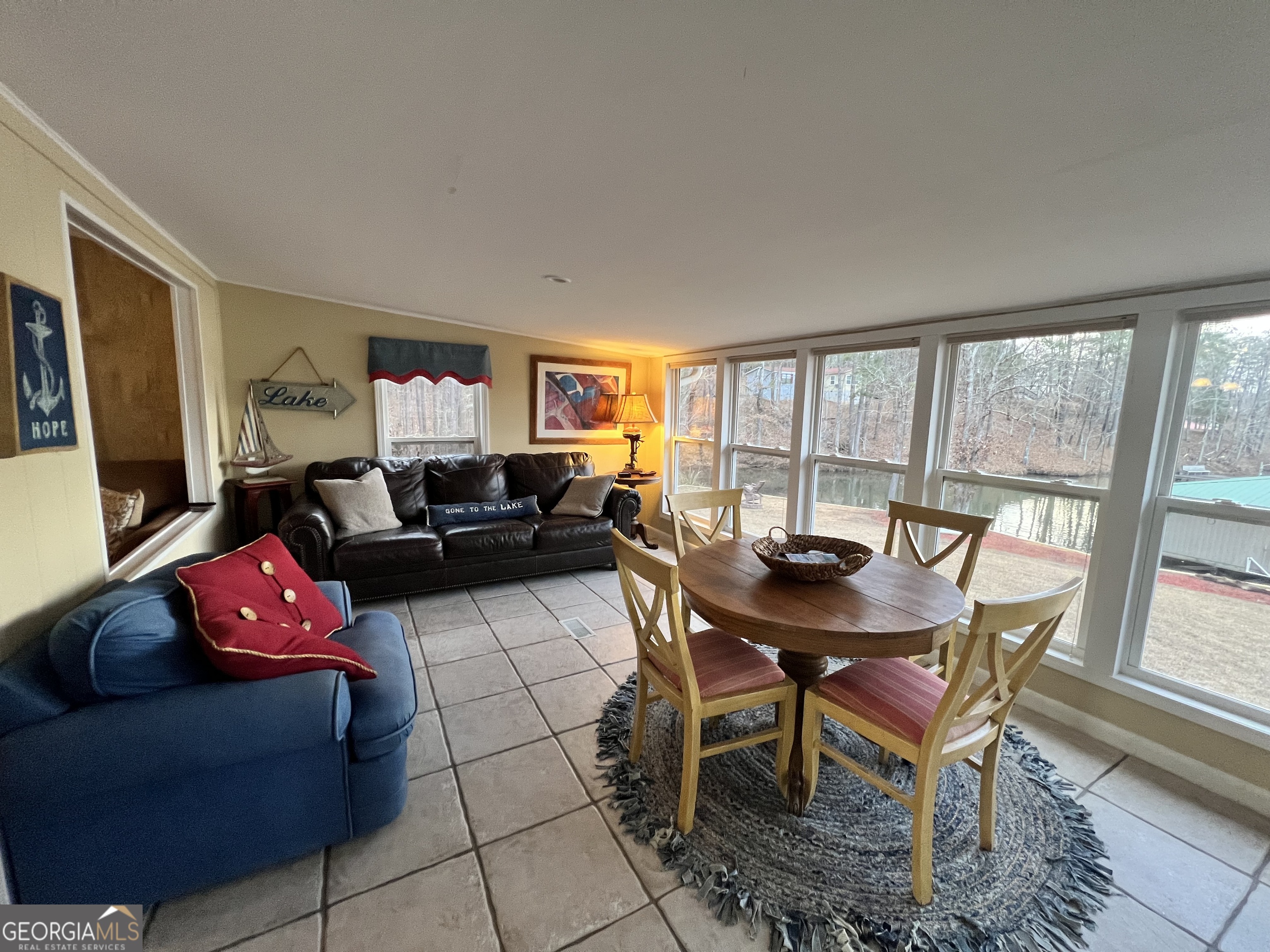 64 Bay Point Sparta, GA 31087 - Photo 23 of 53 a living room with furniture and a large window
