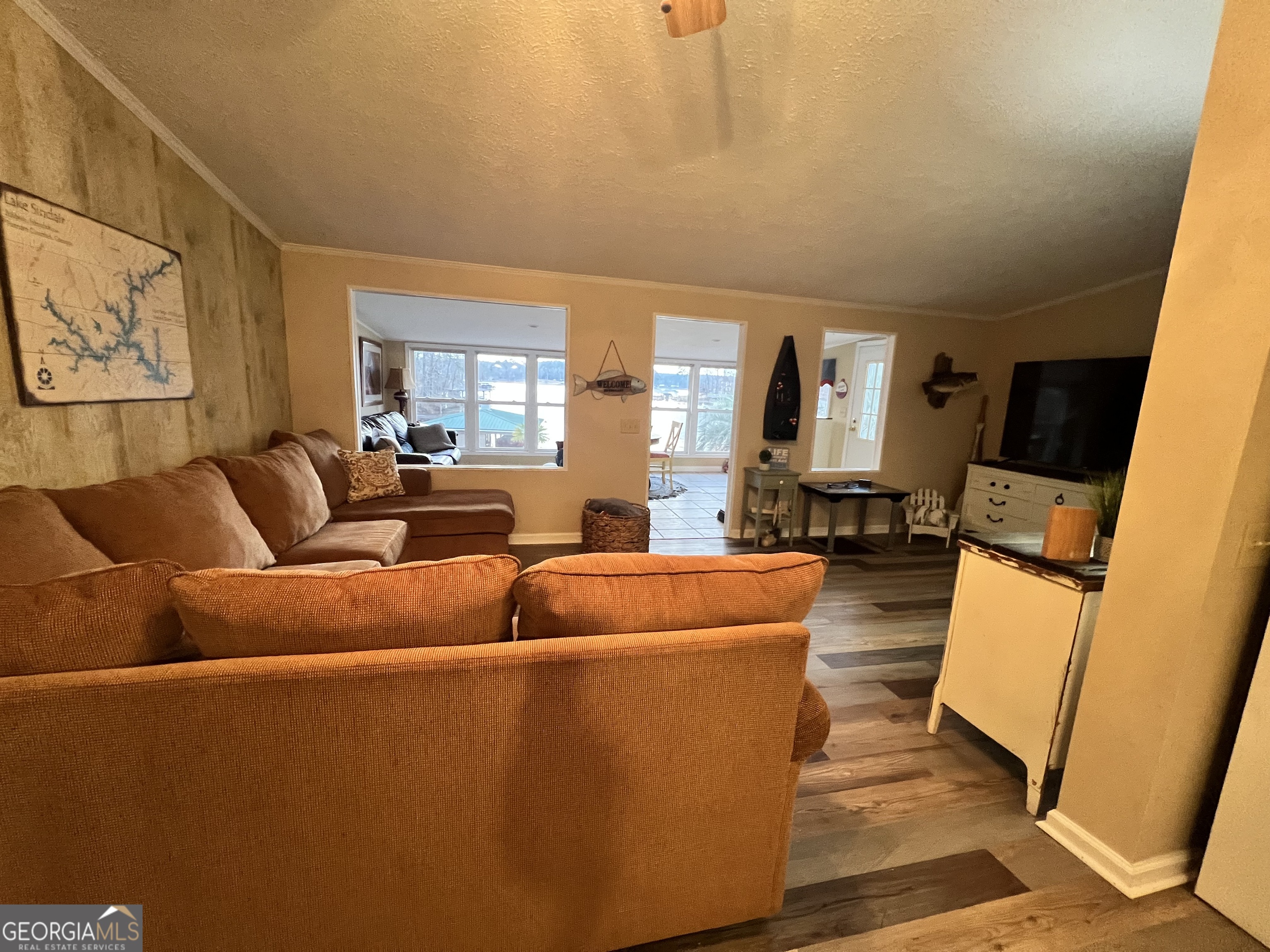 64 Bay Point Sparta, GA 31087 - Photo 28 of 53 a living room with furniture a couch and a large window