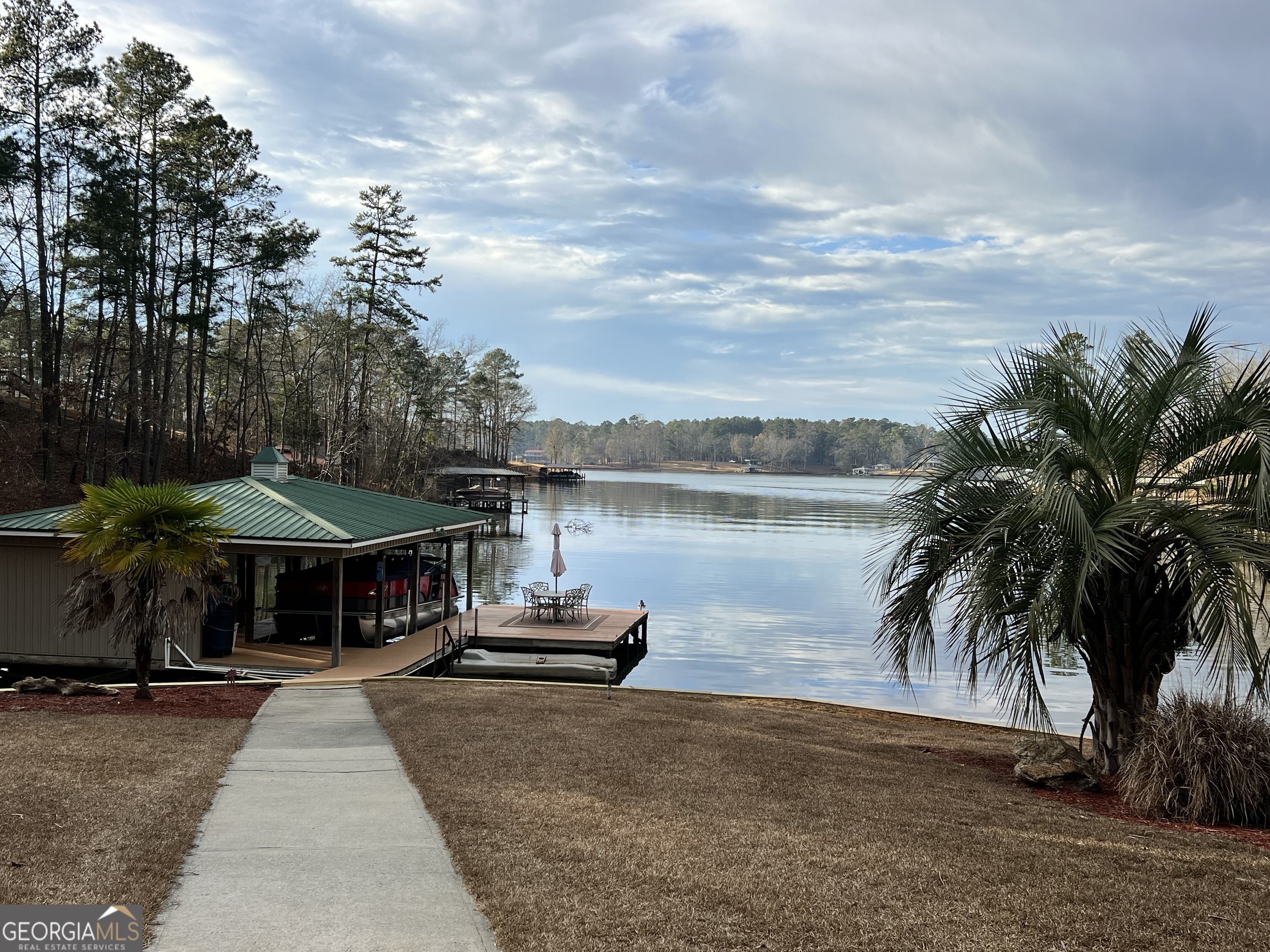 64 Bay Point Sparta, GA 31087 - Photo 36 of 53 a front view of a house with yard and lake view