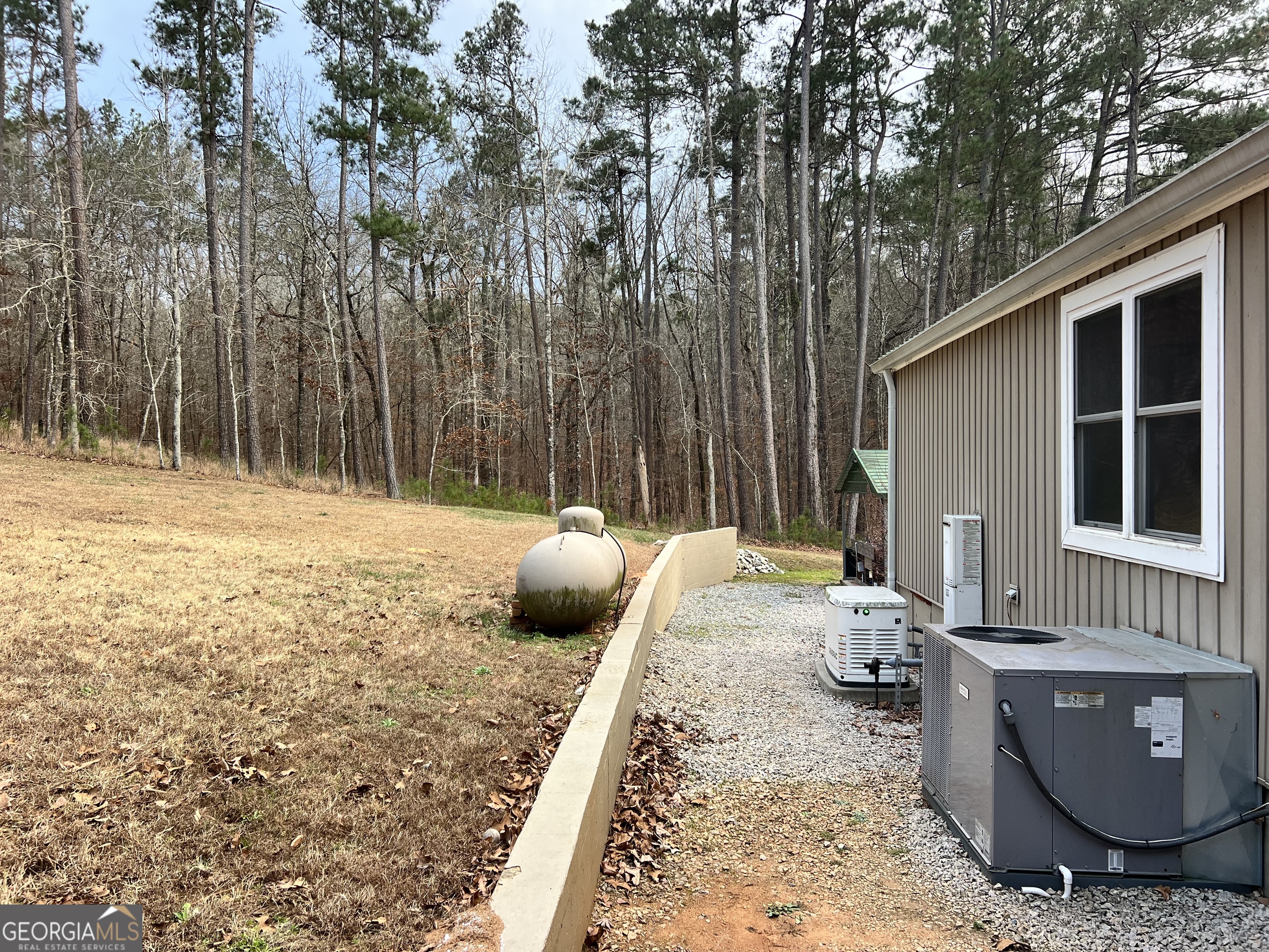 64 Bay Point Sparta, GA 31087 - Photo 52 of 53 a backyard of a house with seating space
