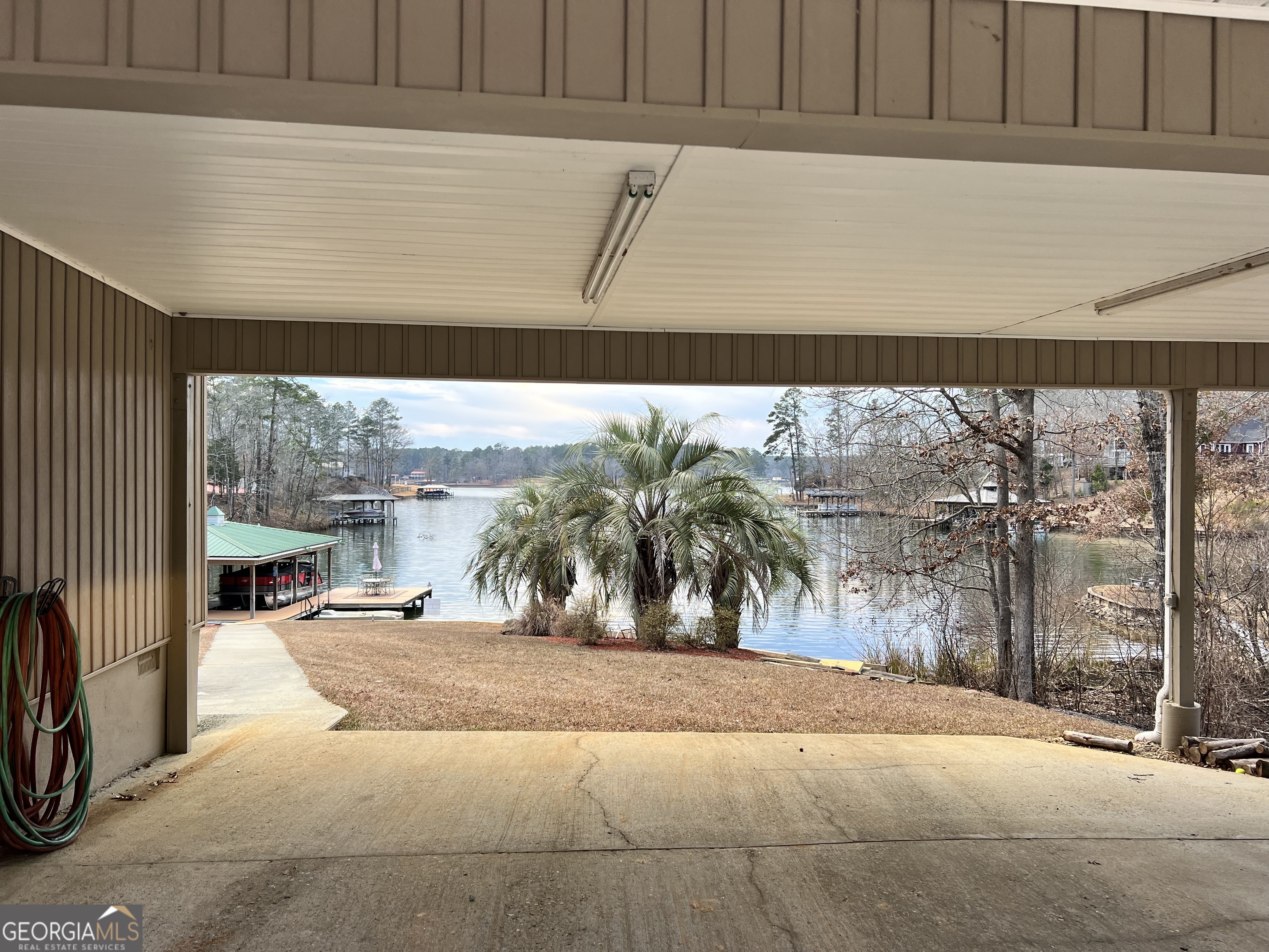 64 Bay Point Sparta, GA 31087 - Photo 53 of 53 a view of a living room and a floor to ceiling window