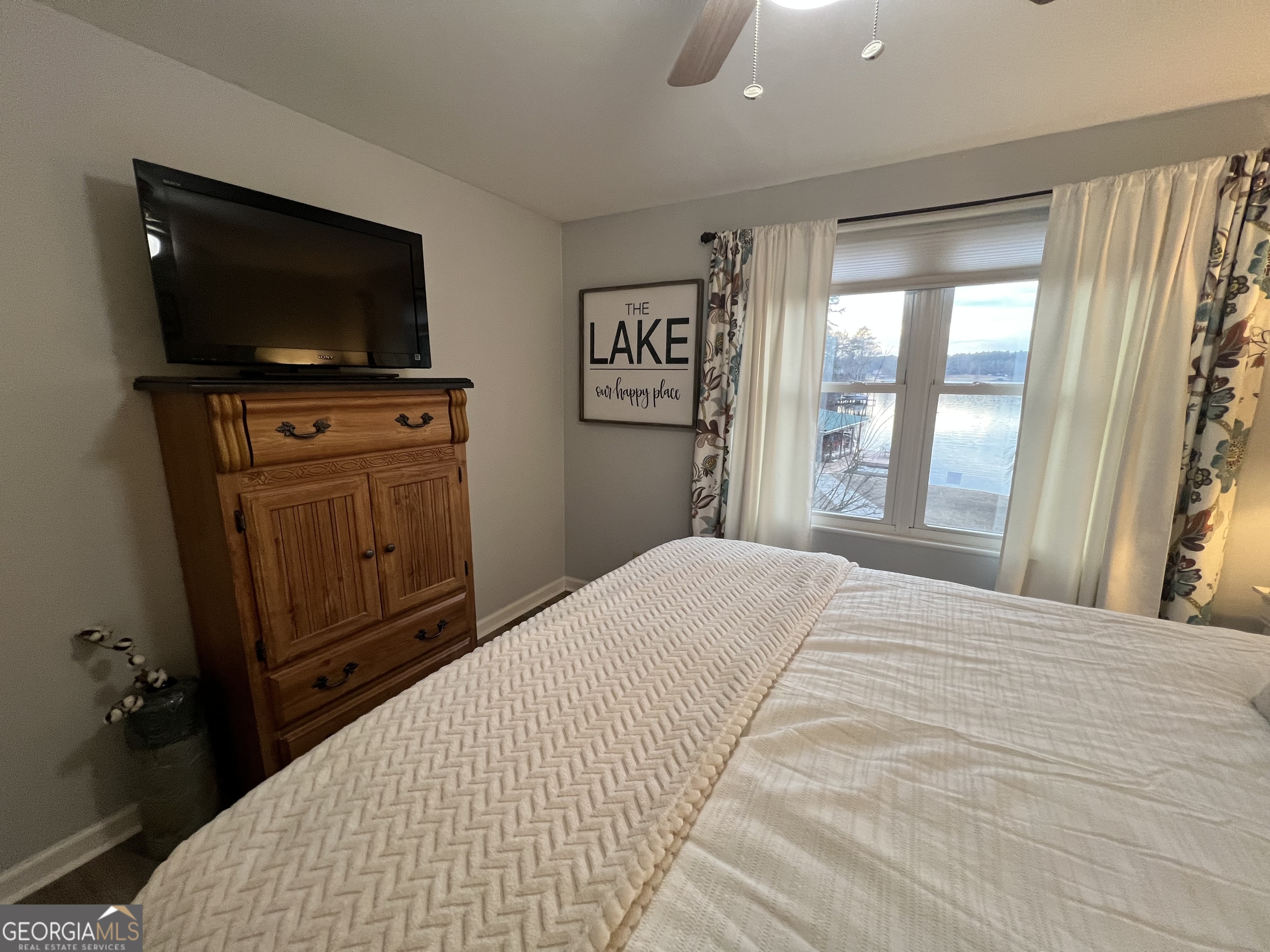 64 Bay Point Sparta, GA 31087 - Photo 8 of 53 a bedroom with a bed and a flat screen tv