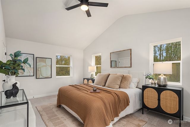 a bedroom with bed and window