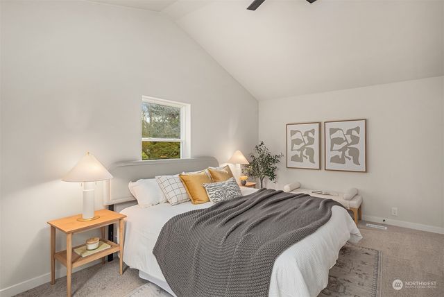 a bedroom with a bed and a night stand