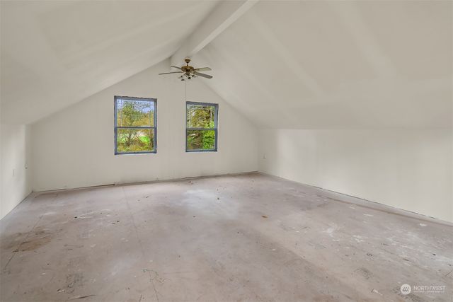 an empty room with windows and view