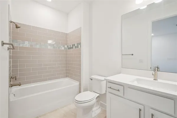 a bathroom with a sink toilet and bathtub