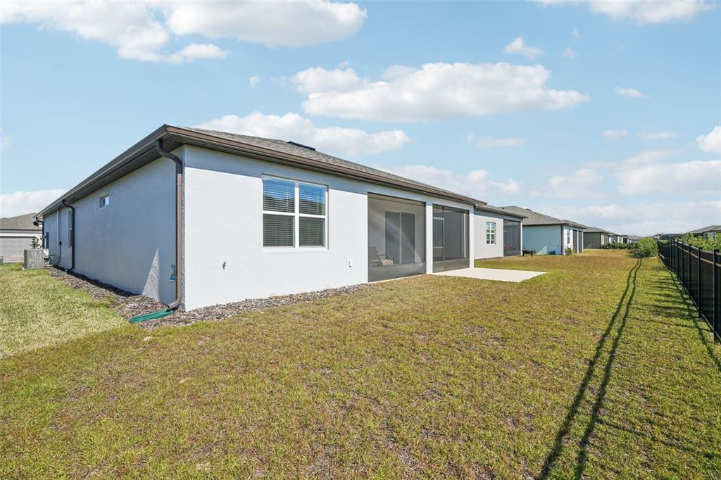 5236 Southwest 88th Circle Ocala, FL 34481 - Photo 28 of 29 a house view with swimming pool and wooden fence