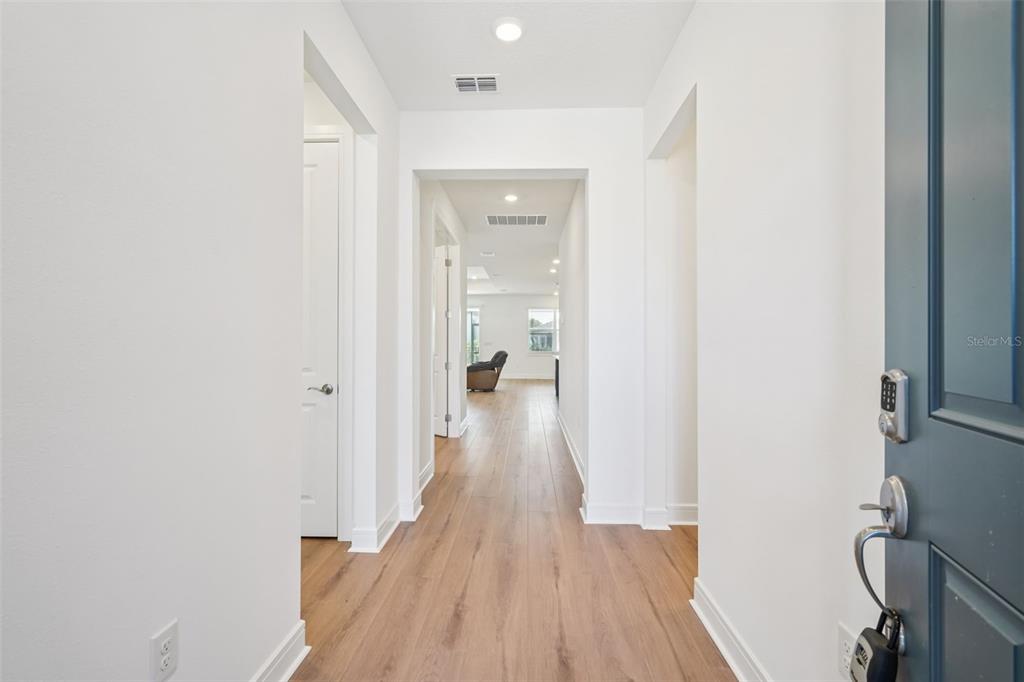 5236 Southwest 88th Circle Ocala, FL 34481 - Photo 4 of 29 a view of a hallway with wooden floor