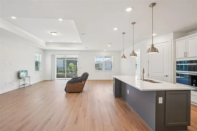 a kitchen with a table and chairs in it