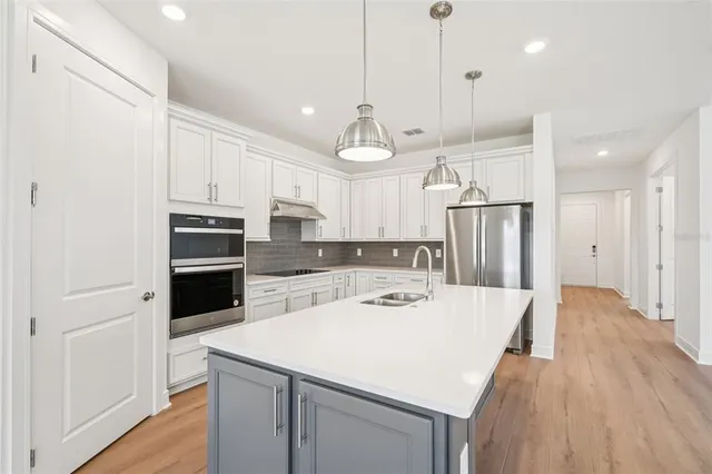 a living room with furniture flowerpot and a table