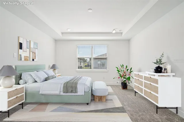 a spacious bathroom with a double vanity sink a mirror and a shower