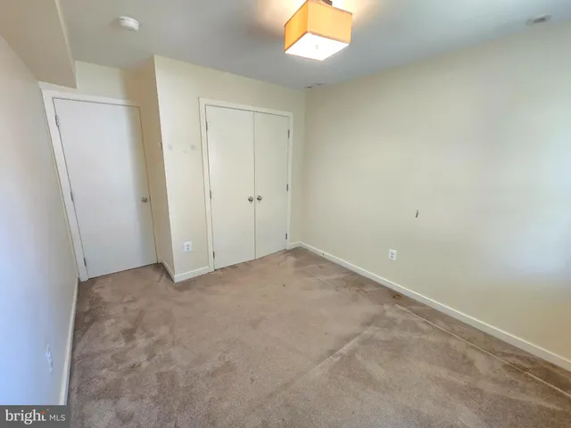 a view of an empty room and a window