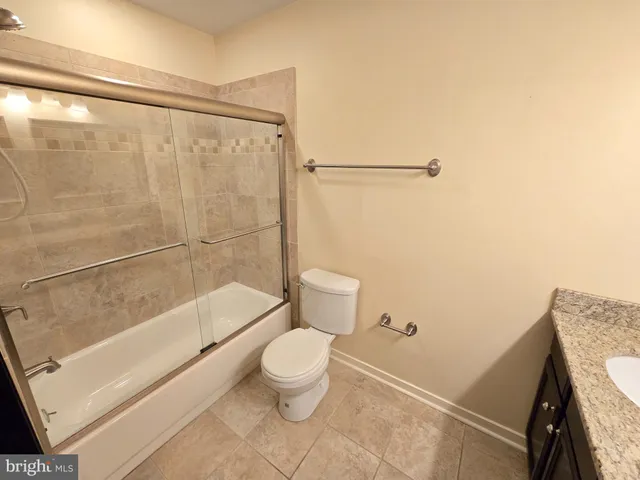 a bathroom with a shower and a toilet