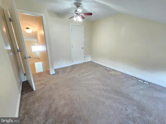 wooden floor in an empty room with a mirror