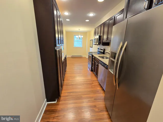 a view of a kitchen from the stairs