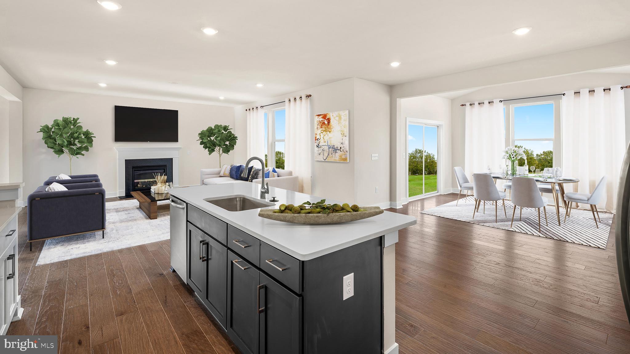 1153 Mariwill Drive Quakertown, PA 18951 - Photo 11 of 14 a kitchen with a stove and a wooden floor