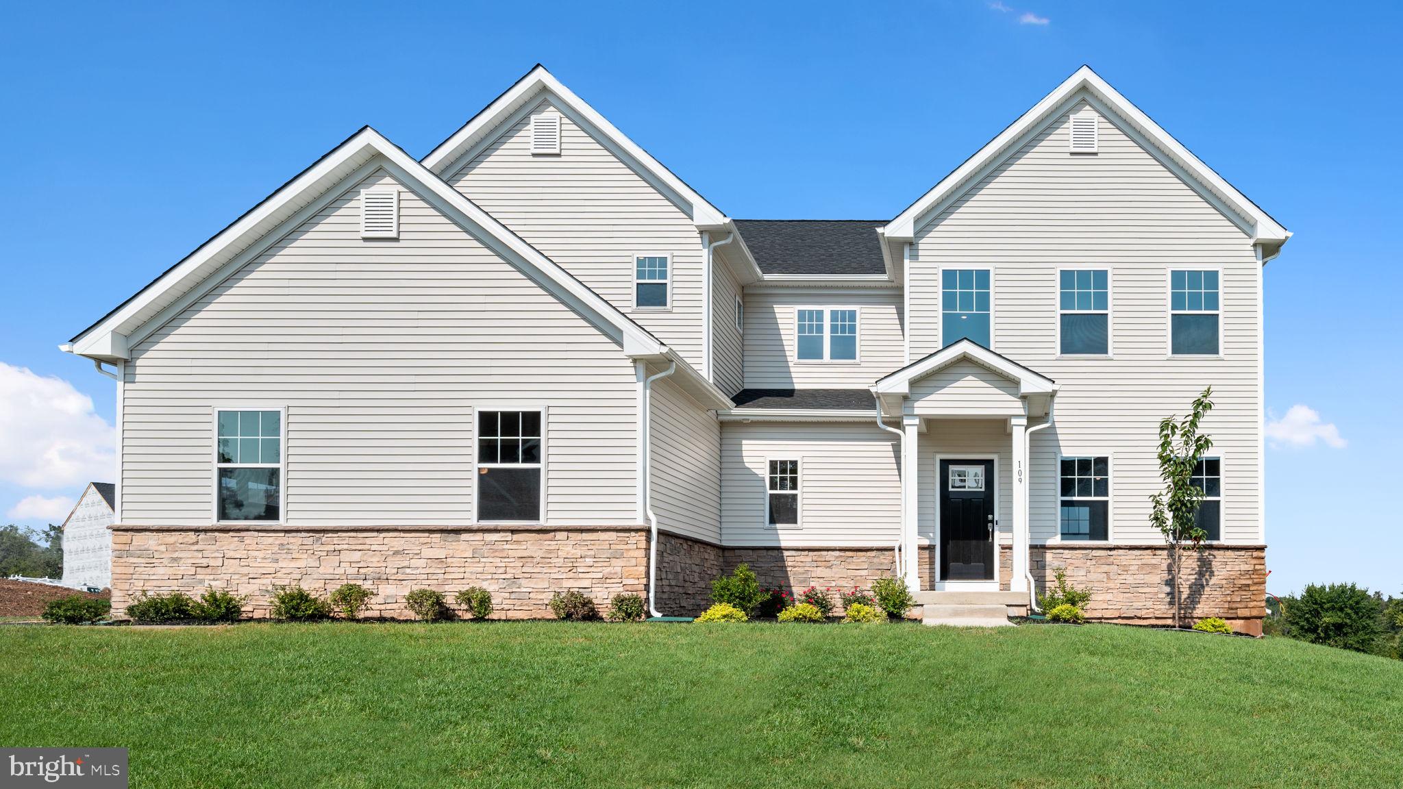 1153 Mariwill Drive Quakertown, PA 18951 - Photo 13 of 14 a front view of a house with a yard