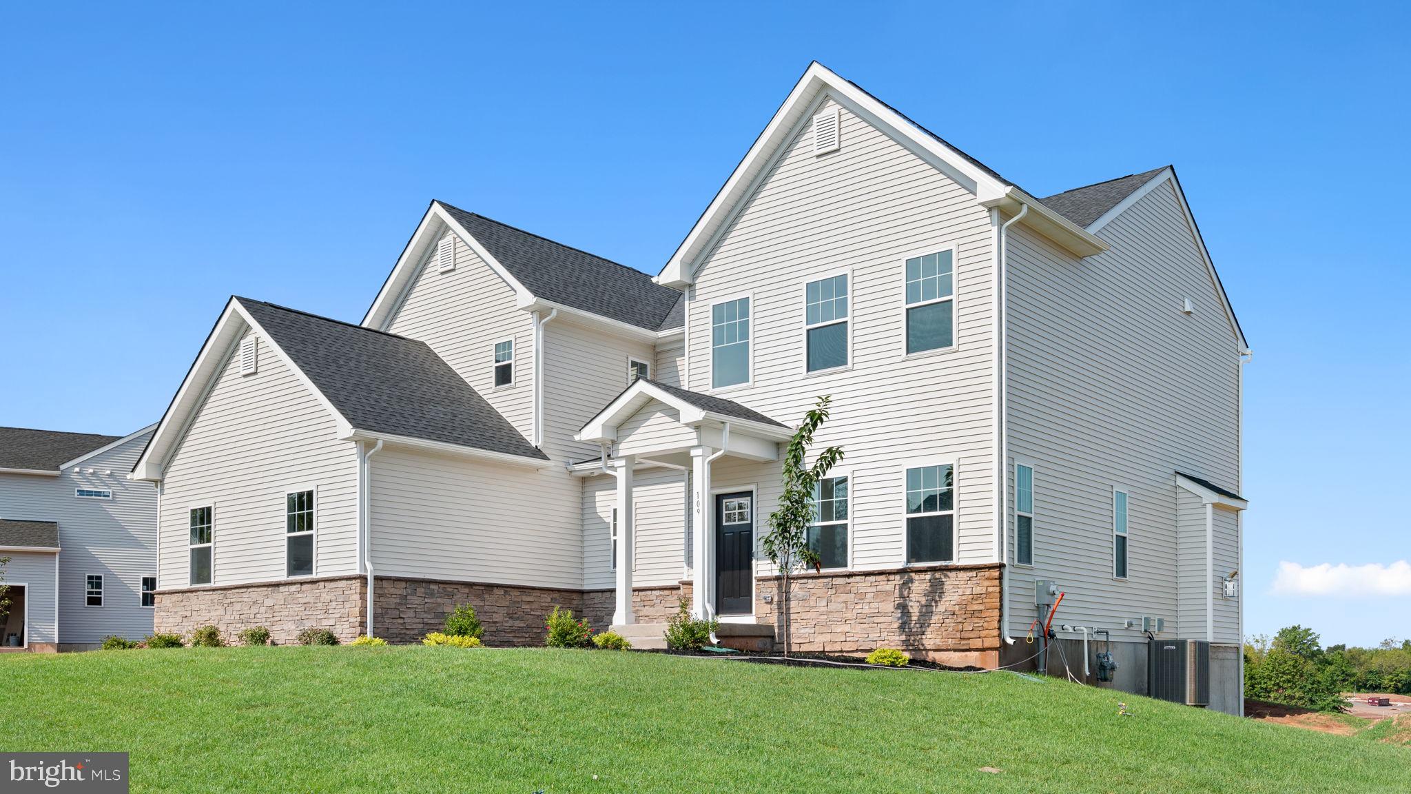 1153 Mariwill Drive Quakertown, PA 18951 - Photo 14 of 14 a view of a house with a yard and porch