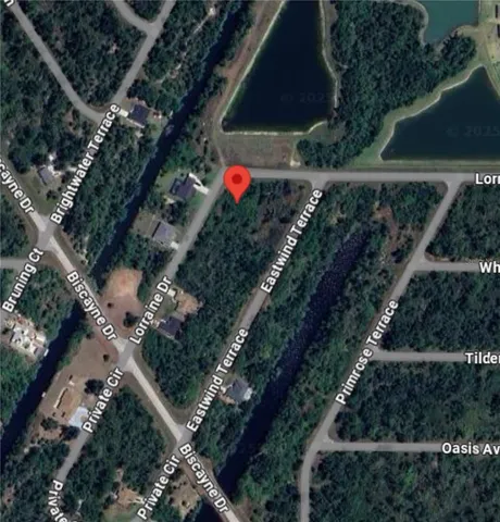 a backyard of a house with a yard and outdoor seating