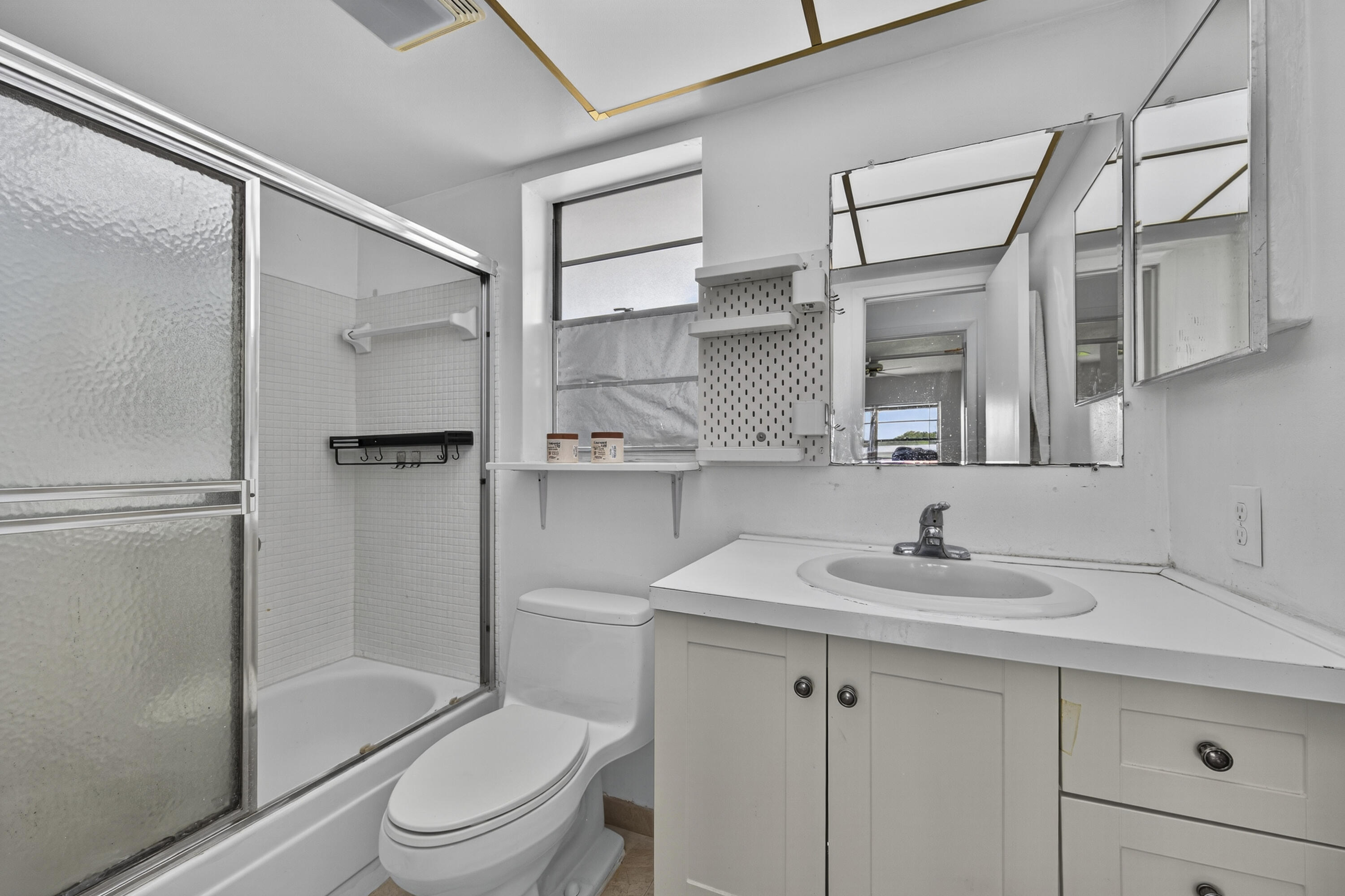 251 South Golf Boulevard, Unit 287 Pompano Beach, FL 33064 - Photo 24 of 63 a bathroom with a sink toilet and shower