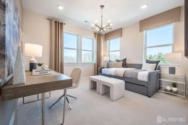 a spacious bathroom with a tub sink toilet and shower
