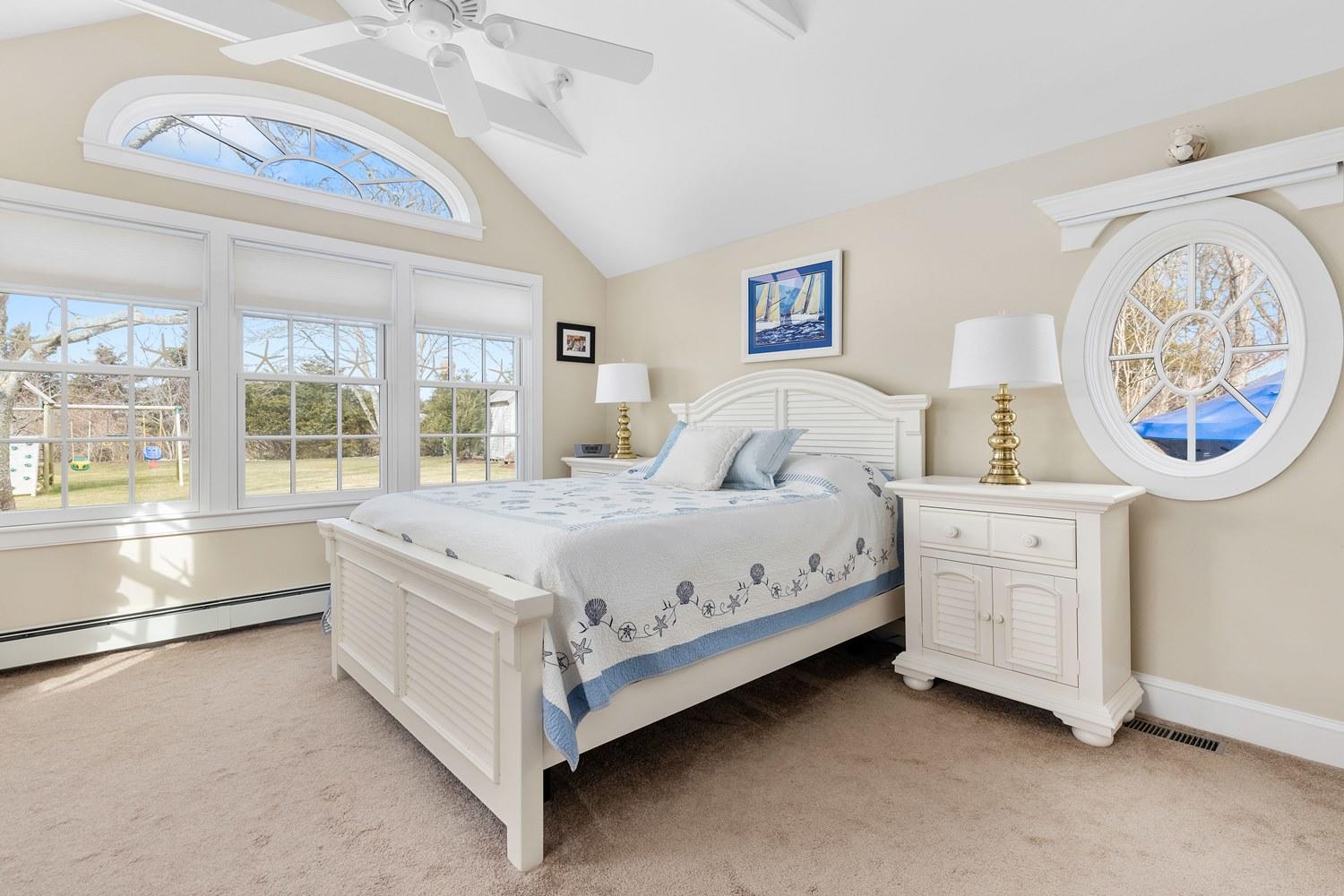 368 Stage Harbor Road Chatham, MA 02633 - Photo 19 of 41 a bedroom with a bed and a large window