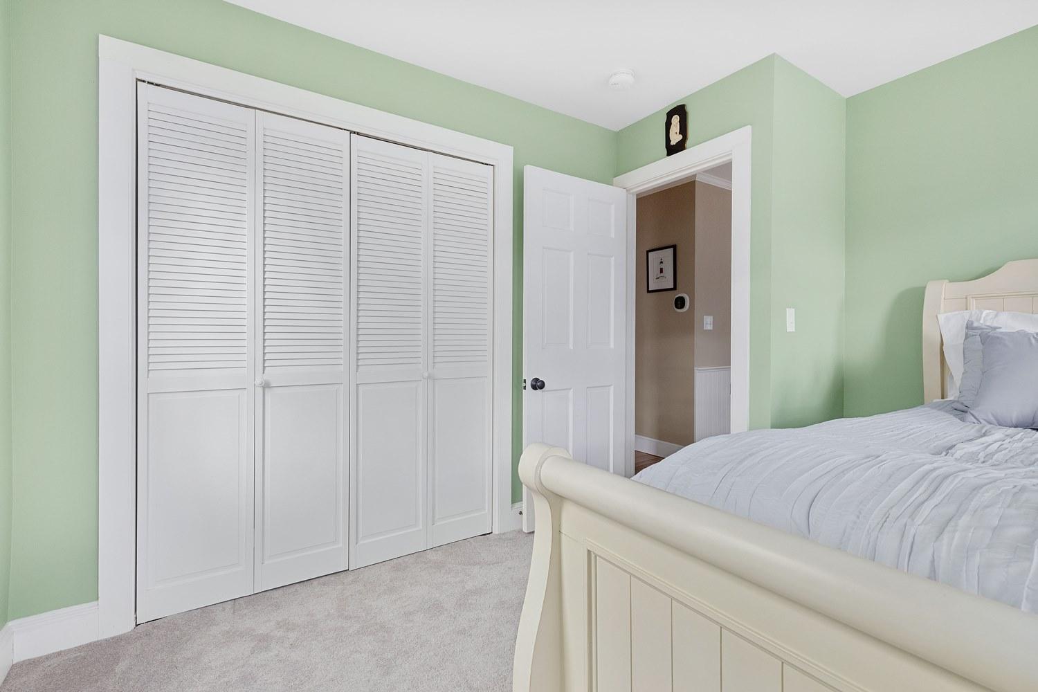 368 Stage Harbor Road Chatham, MA 02633 - Photo 24 of 41 a bedroom with a bed and a cabinet