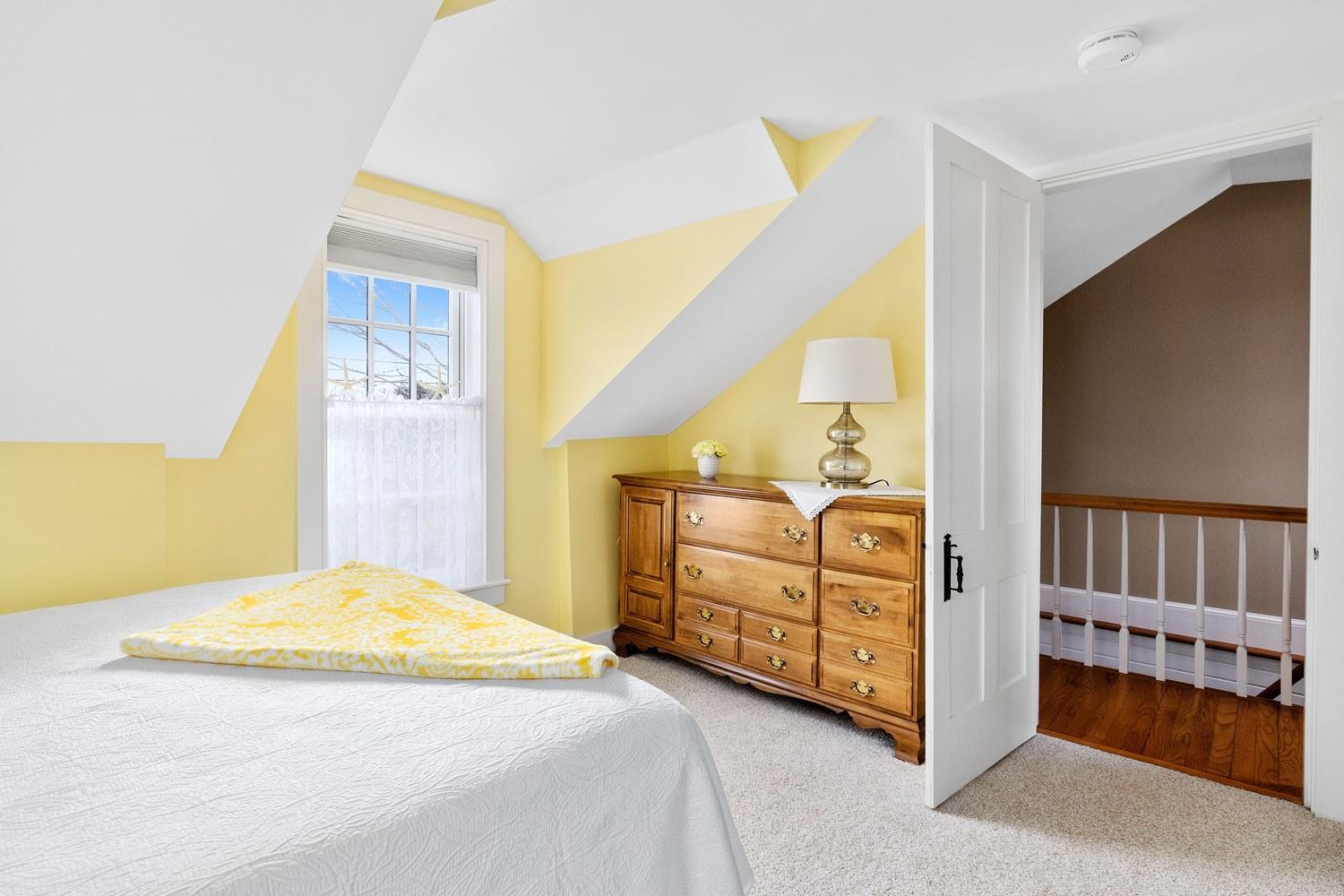368 Stage Harbor Road Chatham, MA 02633 - Photo 33 of 41 a bedroom with a bed a flat tv screen and dresser