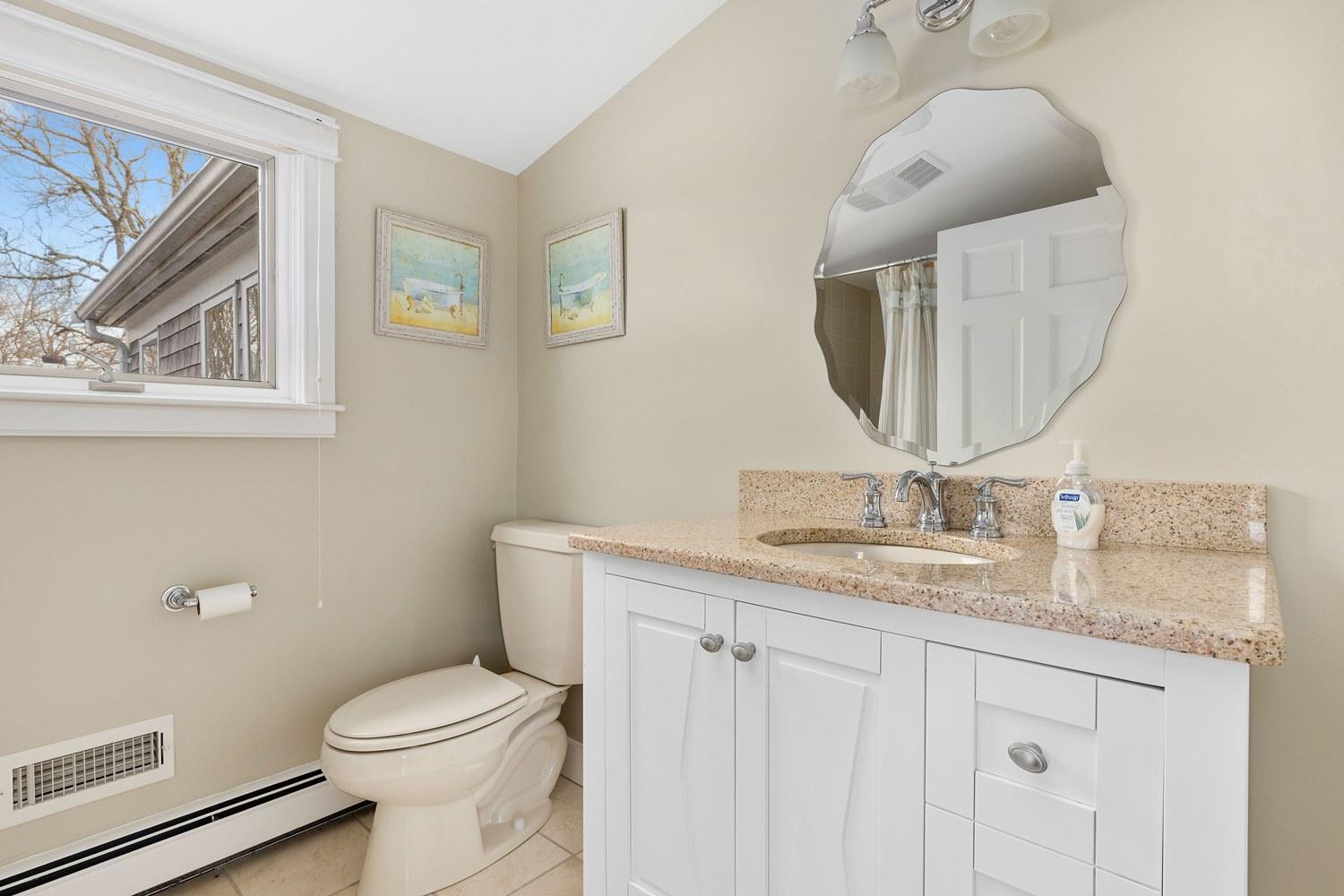 368 Stage Harbor Road Chatham, MA 02633 - Photo 35 of 41 a bathroom with a granite countertop toilet sink and mirror