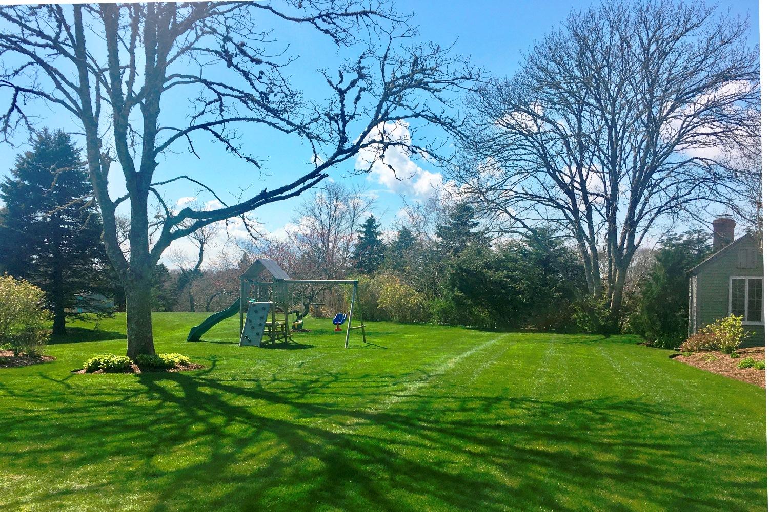 368 Stage Harbor Road Chatham, MA 02633 - Photo 5 of 41 a view of a backyard with a garden