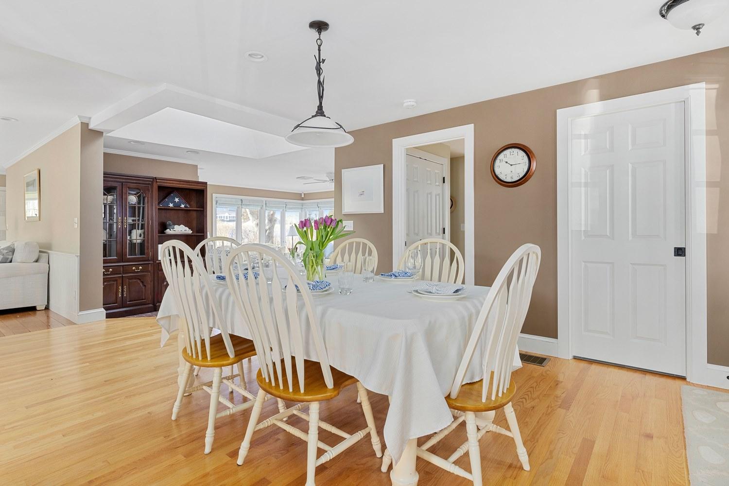 368 Stage Harbor Road Chatham, MA 02633 - Photo 10 of 41 a view of a dining room with furniture and wooden floor