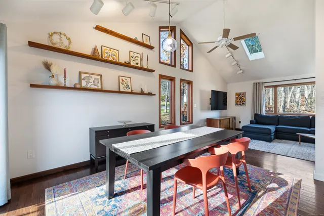 a view of a dining room with furniture and window