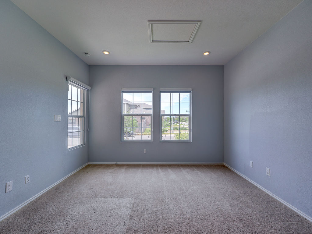 1716 Frontenac Street Leander, TX 78641 - Photo 4 of 34 a view of an empty room with a window