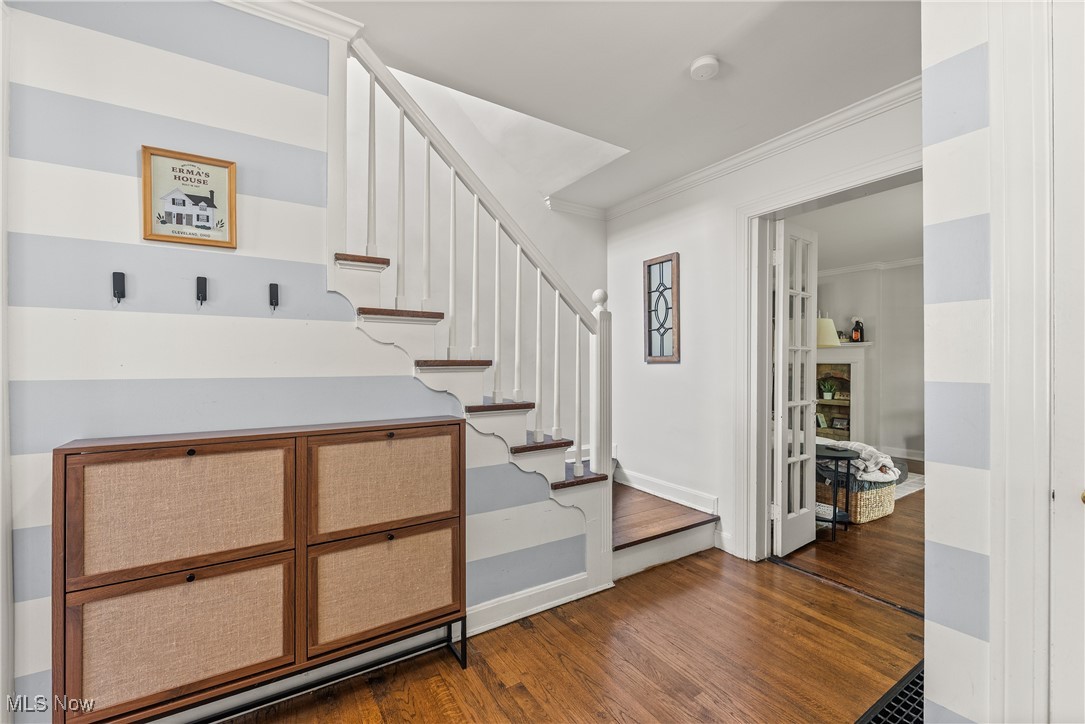 2464 Channing Road Cleveland, OH 44118 - Photo 4 of 44 Stairway with wood finished floors and crown molding