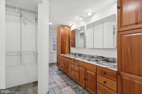 a bathroom with bathtub and window