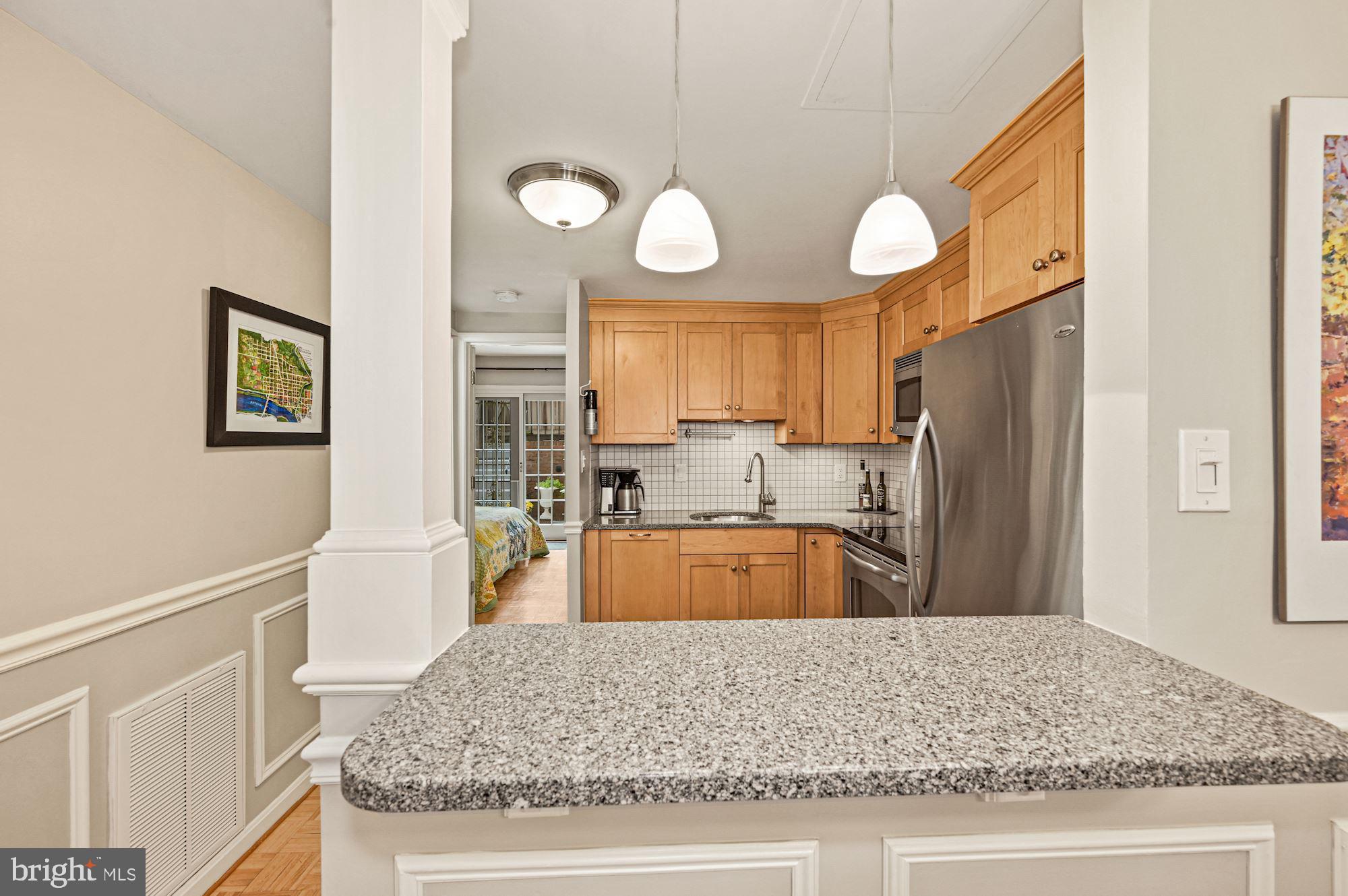 1823 Corcoran Street Northwest, Unit 9 Washington, DC 20009 - Photo 11 of 34 Kitchen Bar - Passthrough