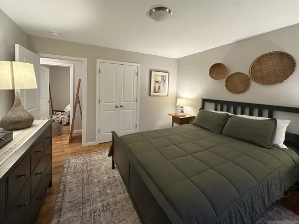 a bed room with a bed and dresser