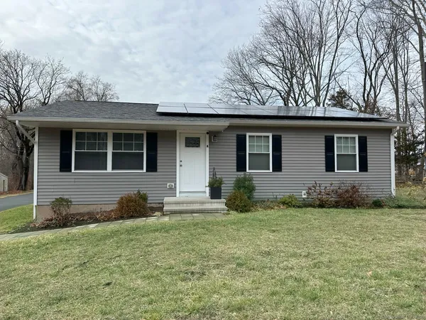 a front view of a house with a yard