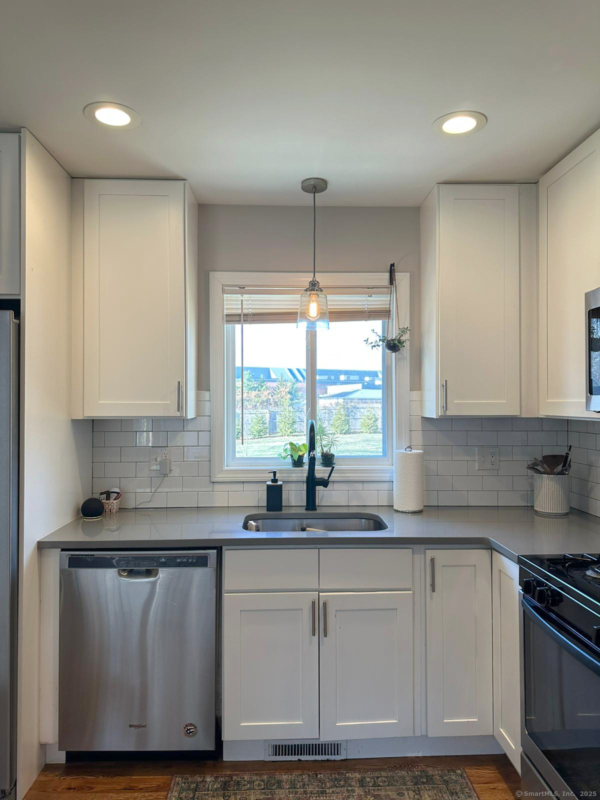 55 Overbrook Road North Haven, CT 06473 - Photo 8 of 21 a kitchen with granite countertop a sink cabinets and window