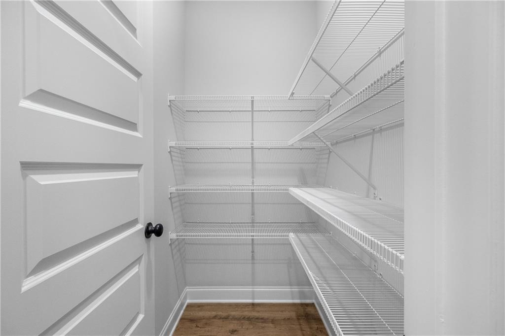 448 Banff Drive Winder, GA 30680 - Photo 8 of 16 a view of walk in closet with empty racks