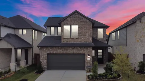 a front view of a house with yard